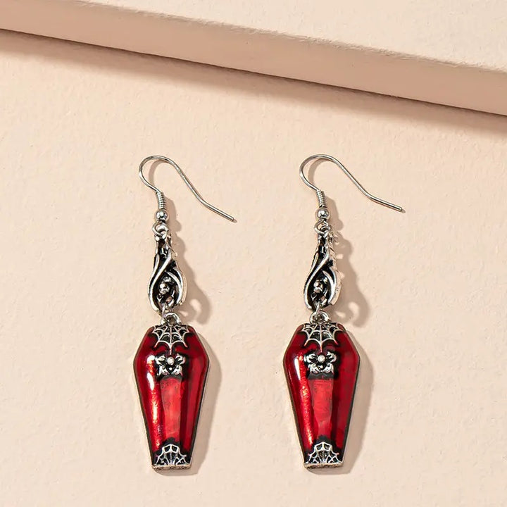 A woman wearing a pair of Maramalive™ Halloween Earrings Ins Style Red Bat Spider Retro Earrings Jewelry.