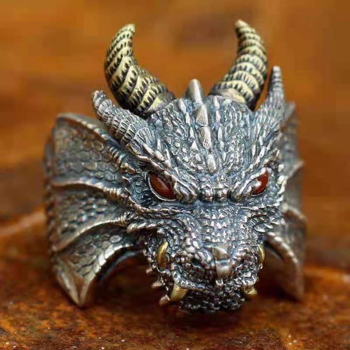 A Maramalive™ dragon ring with red eyes.