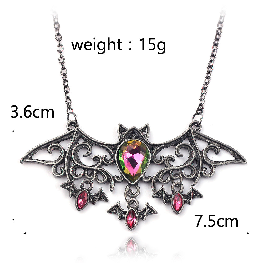 A Maramalive™ Halloween Accessories Vintage Bat Necklace with bats and pink crystals.