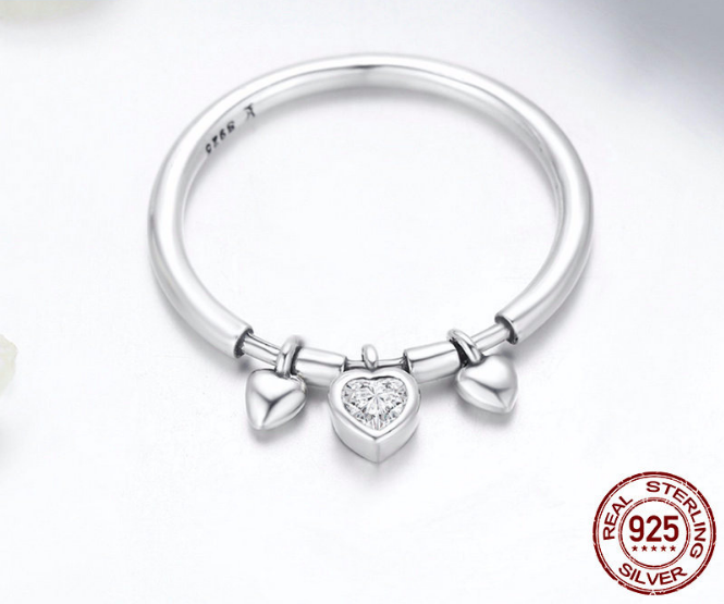 A 925 Silver Ring with Charms from Maramalive™, with two heart charms.