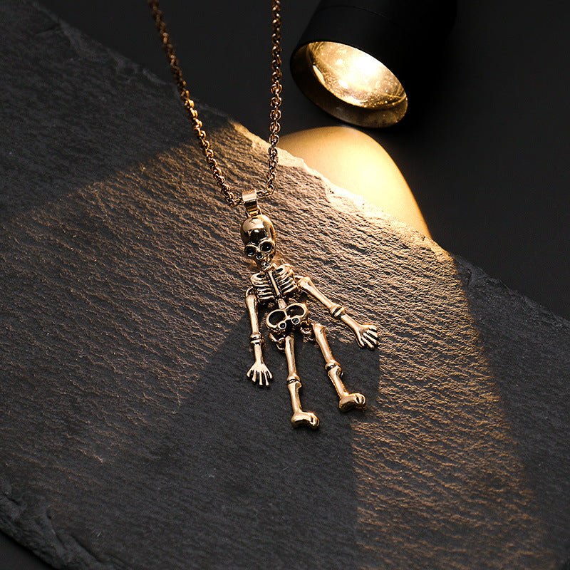 A Dark Halloween Necklace Human Skeleton with a light shining on it by Maramalive™.