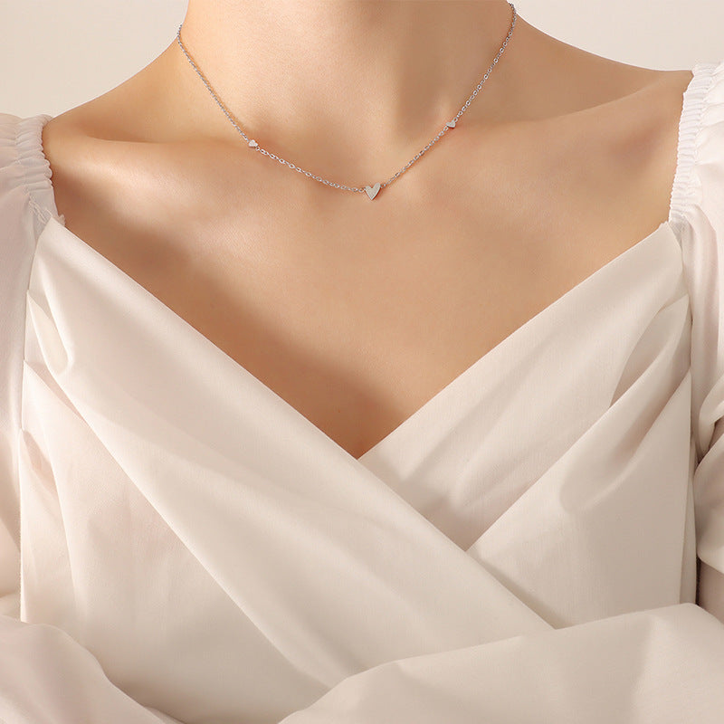 A woman wearing a Little Love Necklace from Maramalive™.