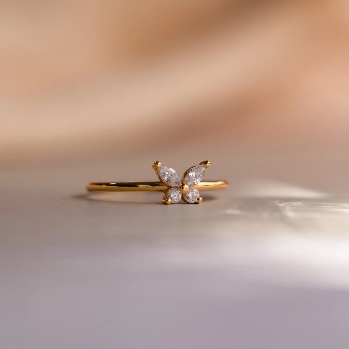A woman wearing a Sweet Full Diamond Butterfly Ring Minimalist Style by Maramalive™.