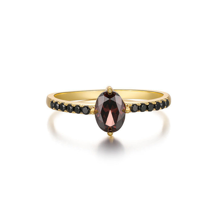 A woman wearing a Maramalive™ Fashion Personality Black Onyx Cluster Ring with a smoky quartz and black diamonds.