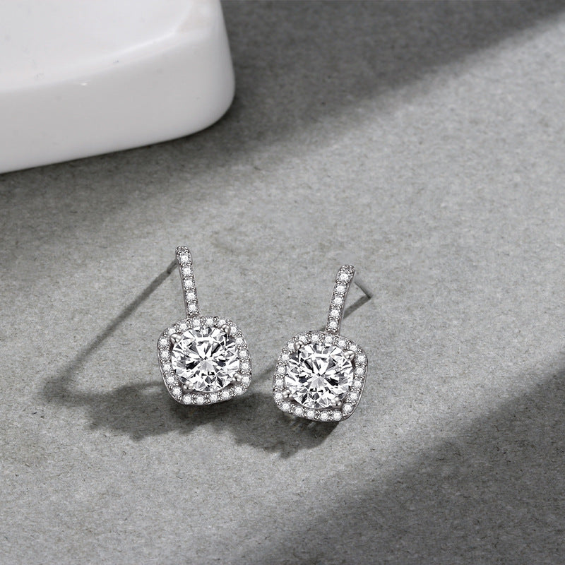 A pair of Maramalive™ Women's Korean-style Simple 925 Sterling Silver Square Zircon Stud Earrings with cubic zirconia.