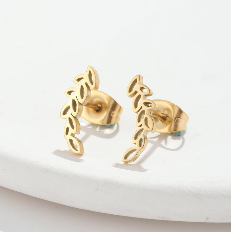 A pair of Stainless Steel Studs Simple Hollow Wheat Earrings for Women by Maramalive™ on a white plate.