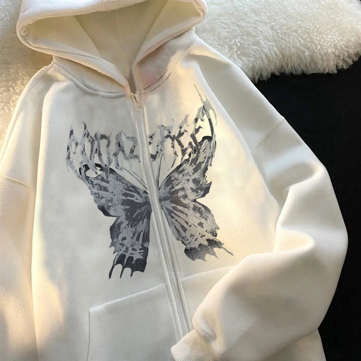 A white Maramalive™ Comfy Zipper Hoodies for Fall: Hooded Sweatshirts & Sweaters with a black butterfly graphic and distressed text design on the front, laid out on a white and black surface, makes for the perfect autumn companion.