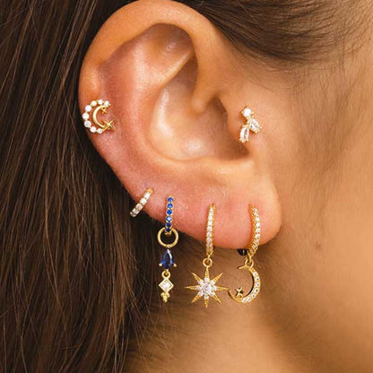 A Women's Mini Diamond Flat Head Piercing S925 Sterling Silver Stud Earrings with a white stone by Maramalive™.