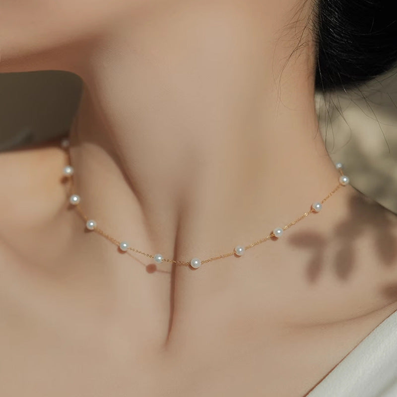 A woman wearing a Starry Natural Freshwater Pearl Necklace by Maramalive™.