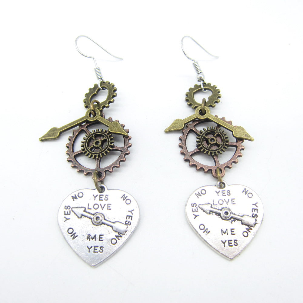 A pair of Maramalive™ Steampunk Heart Earrings with a heart and gears on them.