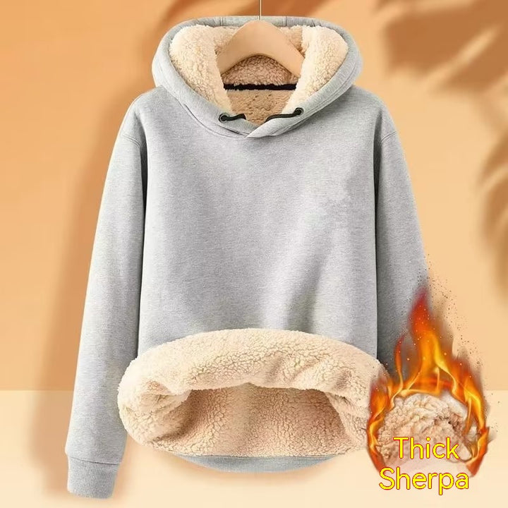 A gray hooded pullover with a sherpa-lined hood and interior, displayed hanging on a wooden hanger. Text reading "Men's Fleece Hoodie Winter Lined Padded Warm Keeping Loose Hooded Sweater" by Maramalive™ is on the bottom right with a fire graphic.