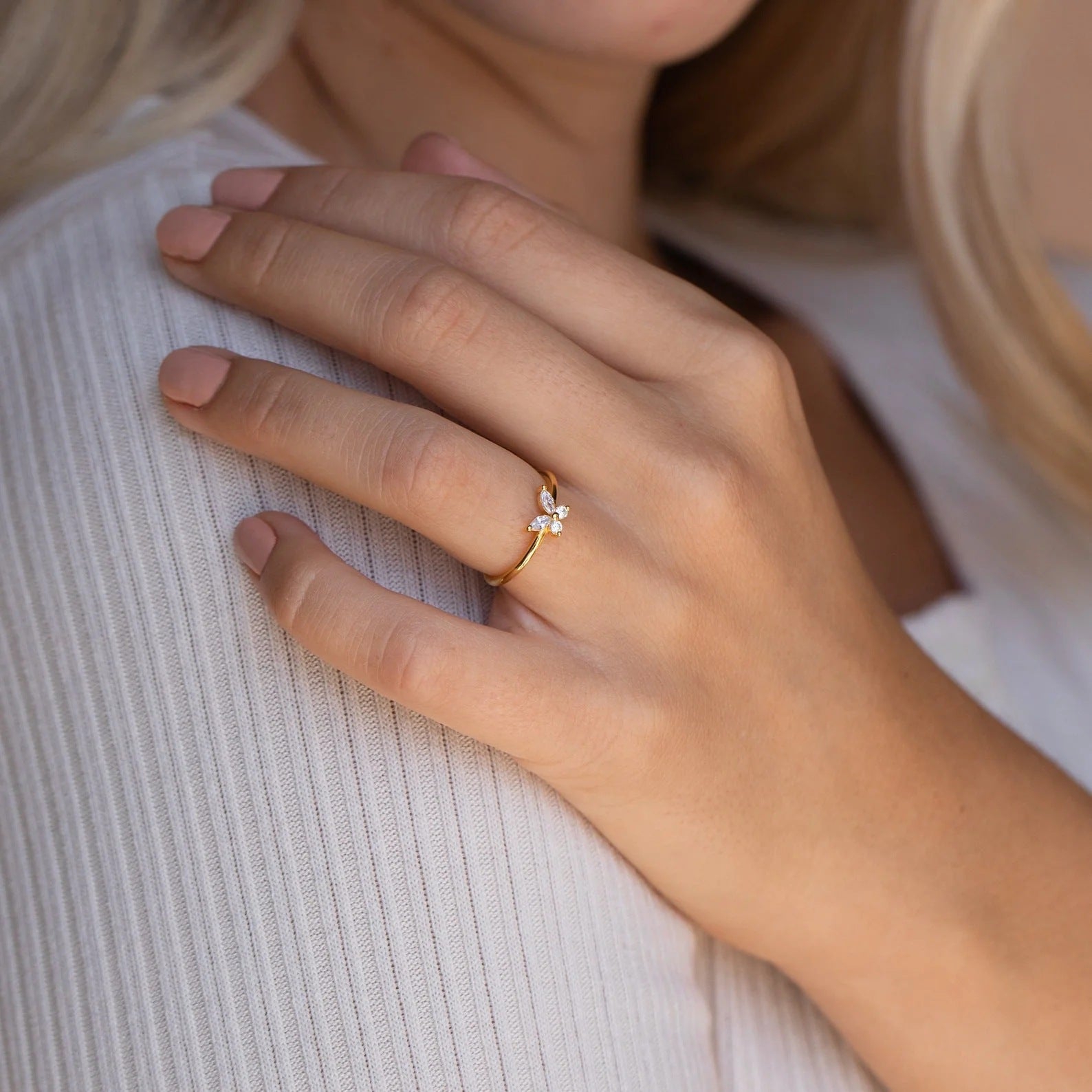 A woman wearing a Sweet Full Diamond Butterfly Ring Minimalist Style by Maramalive™.