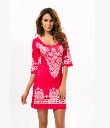 A woman is posing in a pink Rock Bandana Dress by Maramalive™ of baby size.