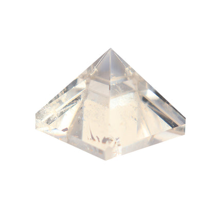 A set of Maramalive™ Quartz Crystal Pyramid Ornaments sitting on top of a wooden box.