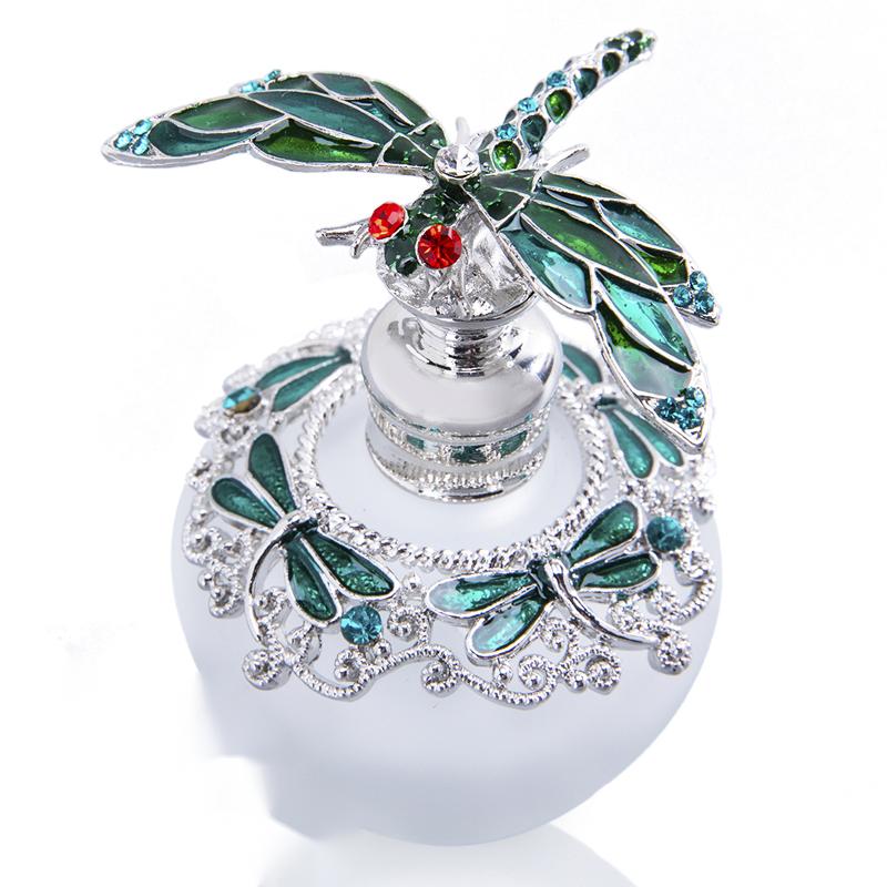 A blue glass Dragonfly Gem Inlaid perfume bottle with a butterfly on it, from the brand Maramalive™.