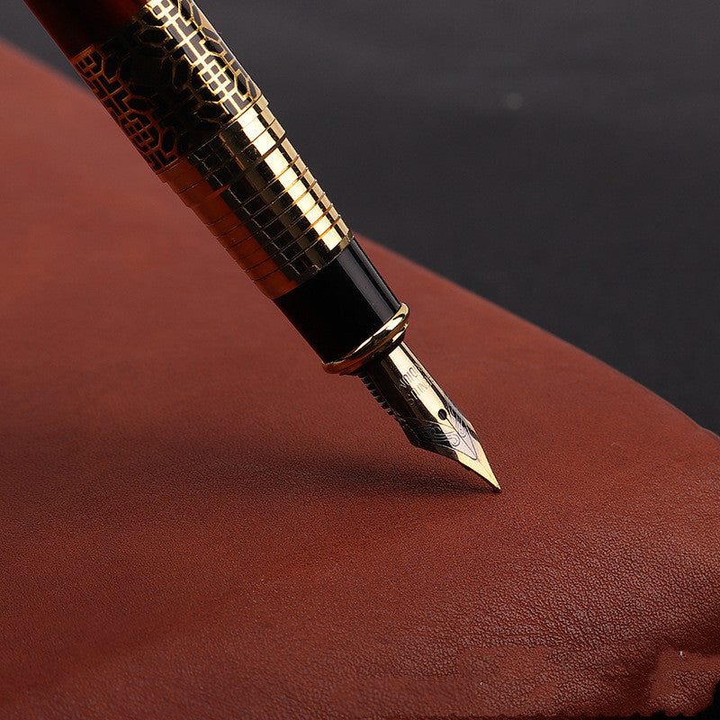 A Maramalive™ wood grain fountain pen metal signature pen and a book on a table.