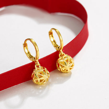 A pair of Women's Fashion Dignified Hollow Hydrangea Circle Earrings by Maramalive™ on a red ribbon.