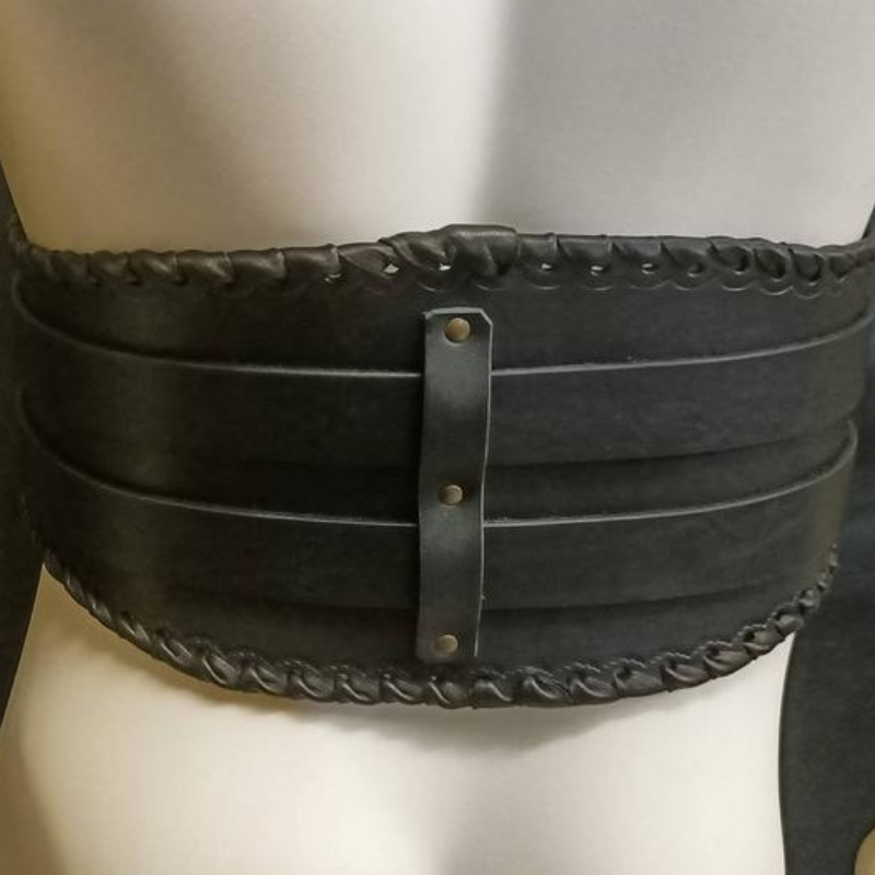 An imitation leather mannequin adorned with a Handmade Armor Belt Medieval Steampunk Dress Up featuring a sleek pin buckle by Maramalive™.