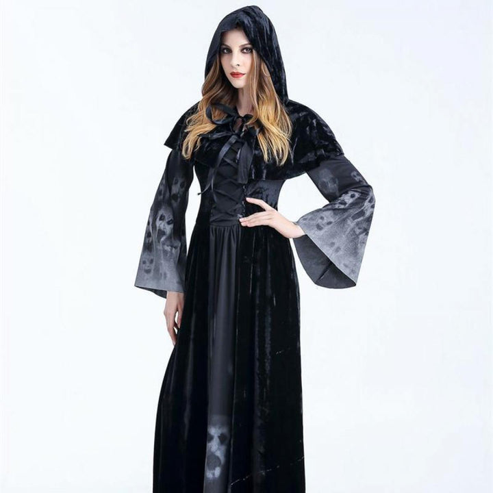 A woman in a Maramalive™ Halloween Women Medieval Gothic Witch Maleficent Horror Scary Cosplay Costume Carnival Party Ghost Long Black Hooded Dress standing in front of a full moon at a Halloween party.