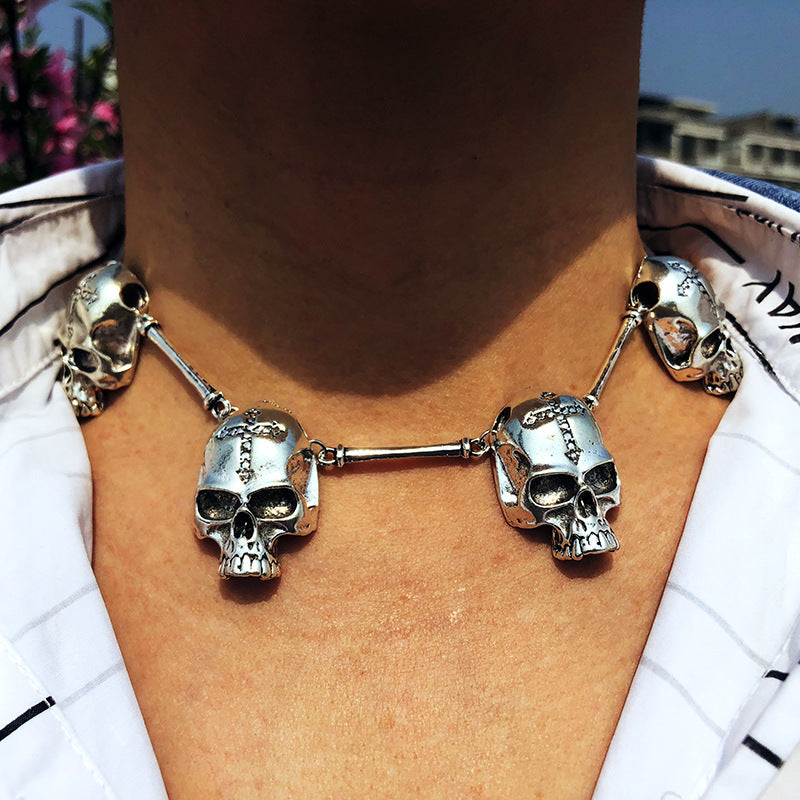 A woman is wearing a Maramalive™ Gothic bird skull necklace.