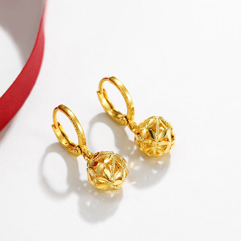 A pair of Women's Fashion Dignified Hollow Hydrangea Circle Earrings by Maramalive™ on a red ribbon.