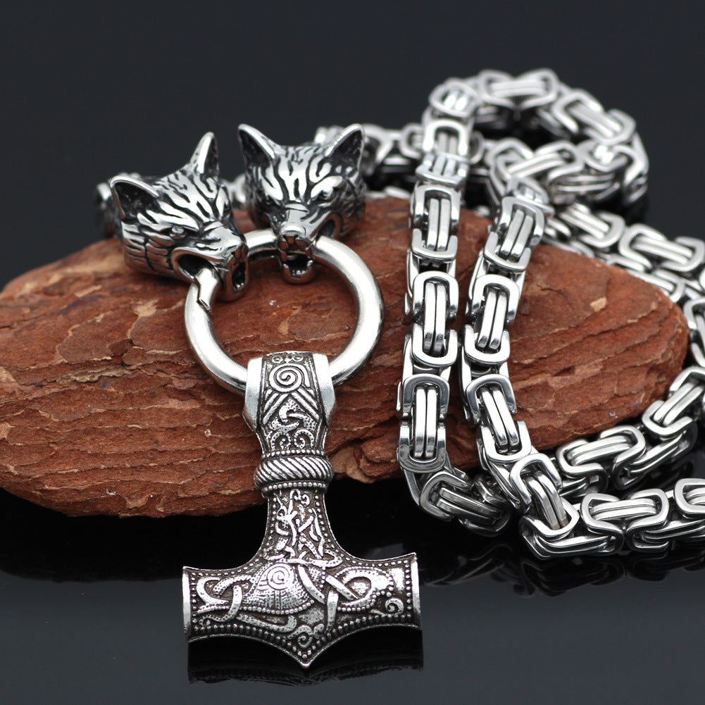 Maramalive™ Vintage Square Chain Titanium Steel Pendant Wolf Head Necklace Men's Sweater Chain with a chain on a rock.