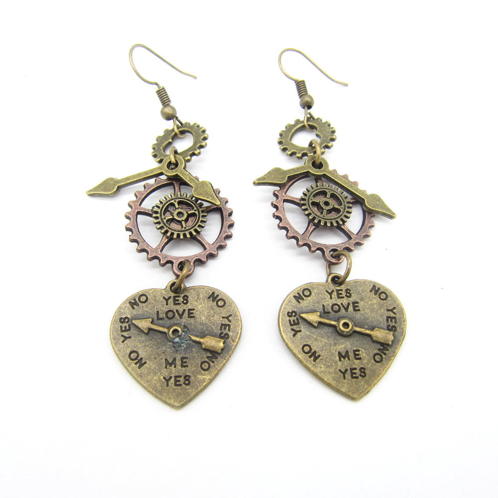 A pair of Maramalive™ Steampunk Heart Earrings with a heart and gears on them.