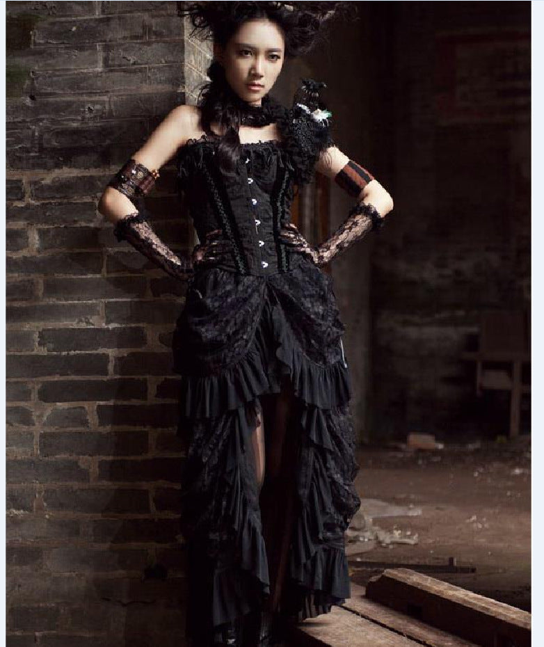 A woman in a Gothic Long Skirts Banquet Birdtail Lace Dress from Maramalive™ is posing in front of a brick wall.