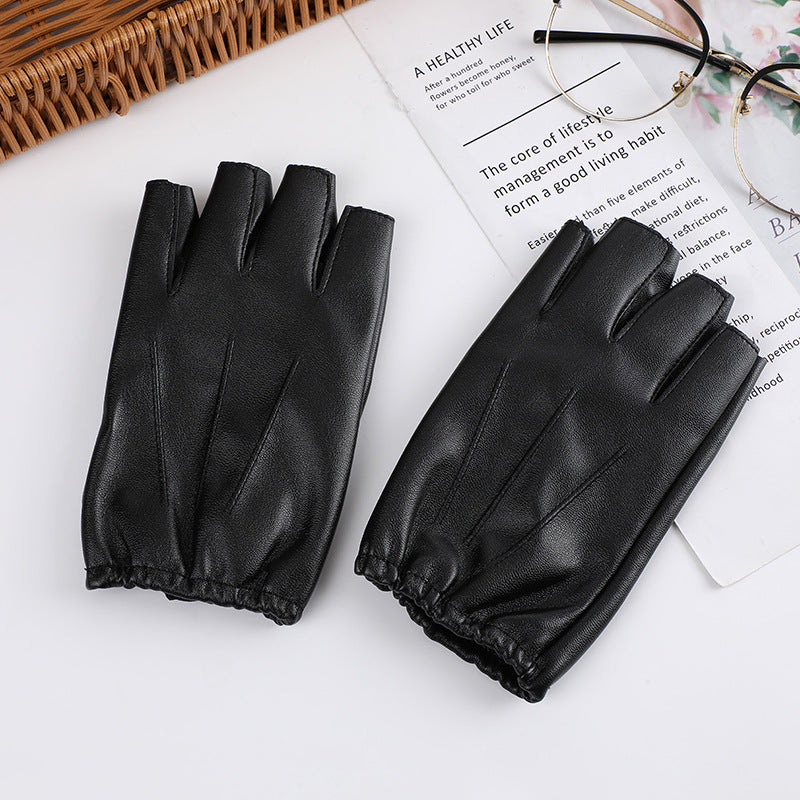 A group of Steampunk Half Finger Gloves - Fashion Statement in PU Leather by Maramalive™ on a table.