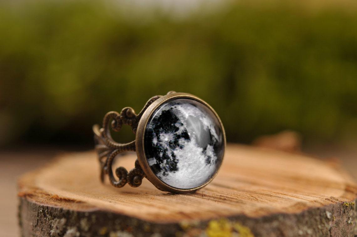 A Vampire Blood Gothic Jewelry Ring with a black and white image of the moon by Maramalive™.