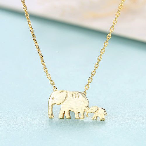 A Maramalive™ Elephant Pendant Necklace with a baby elephant on it.