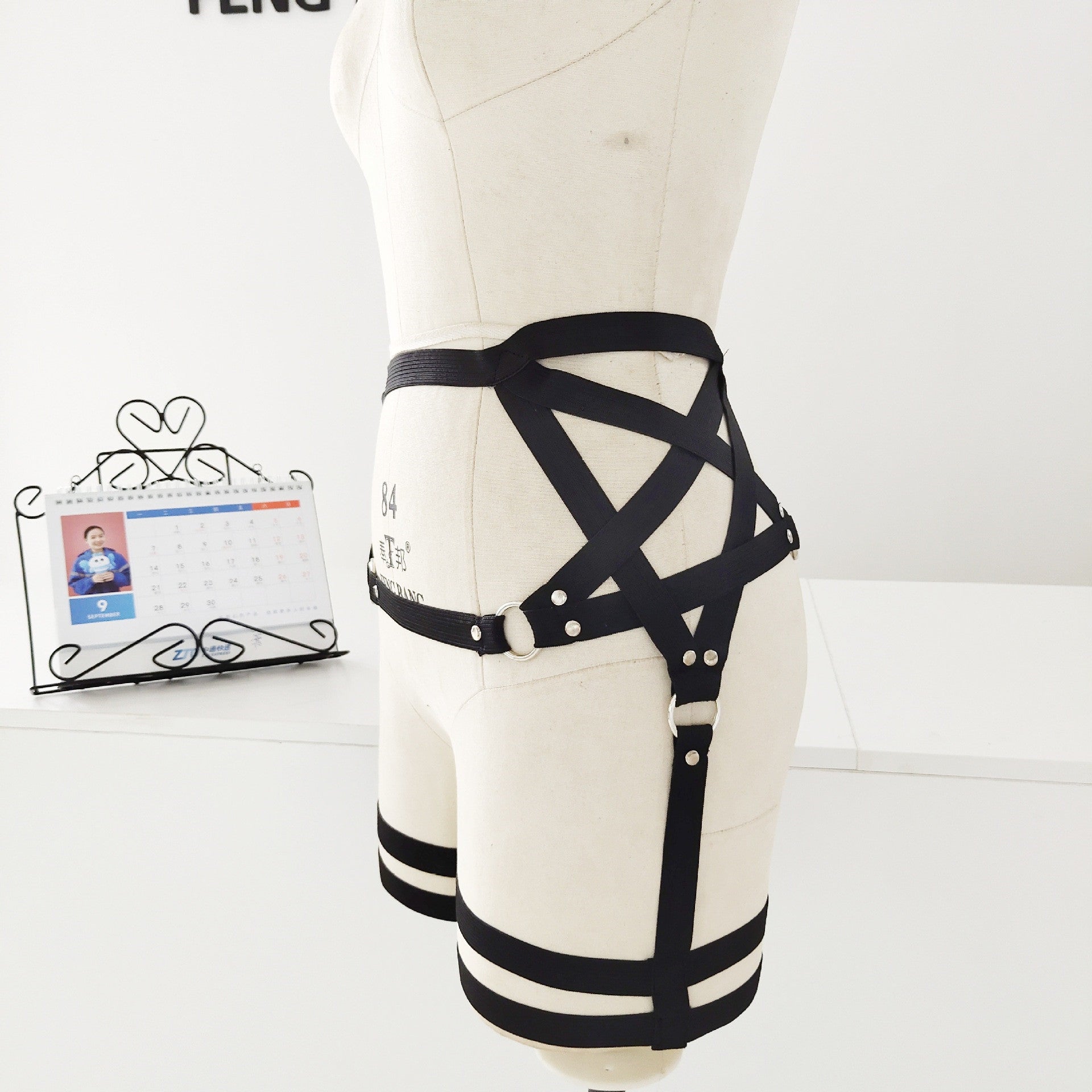 A mannequin wearing a Maramalive™ Harajuku style pentagram Gothic garter leg with strong elasticity.
