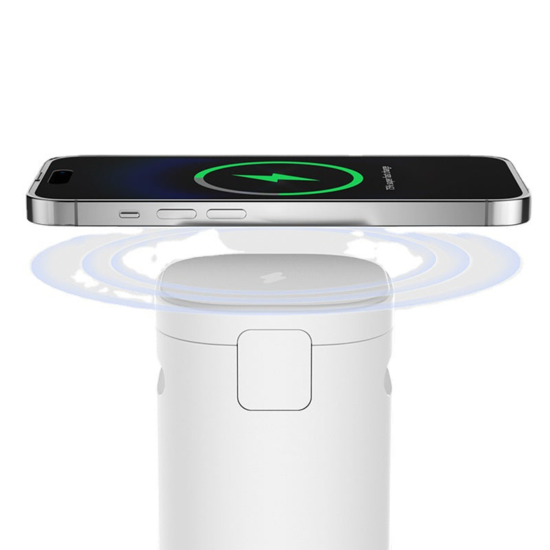 A Three In One Audio Magnetic Absorption Wireless Dual Charger by Maramalive™ is sitting on top of a table.