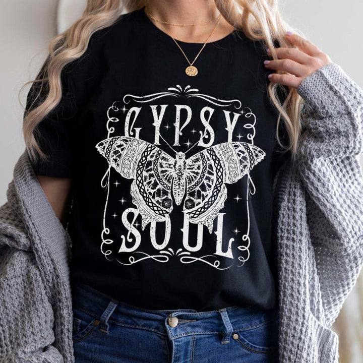 A woman wearing a black Bohemian Gypsy Soul Tee - Bohemian Gypsy Soul Tee - Butterfly Loose T-shirt by Maramalive™.