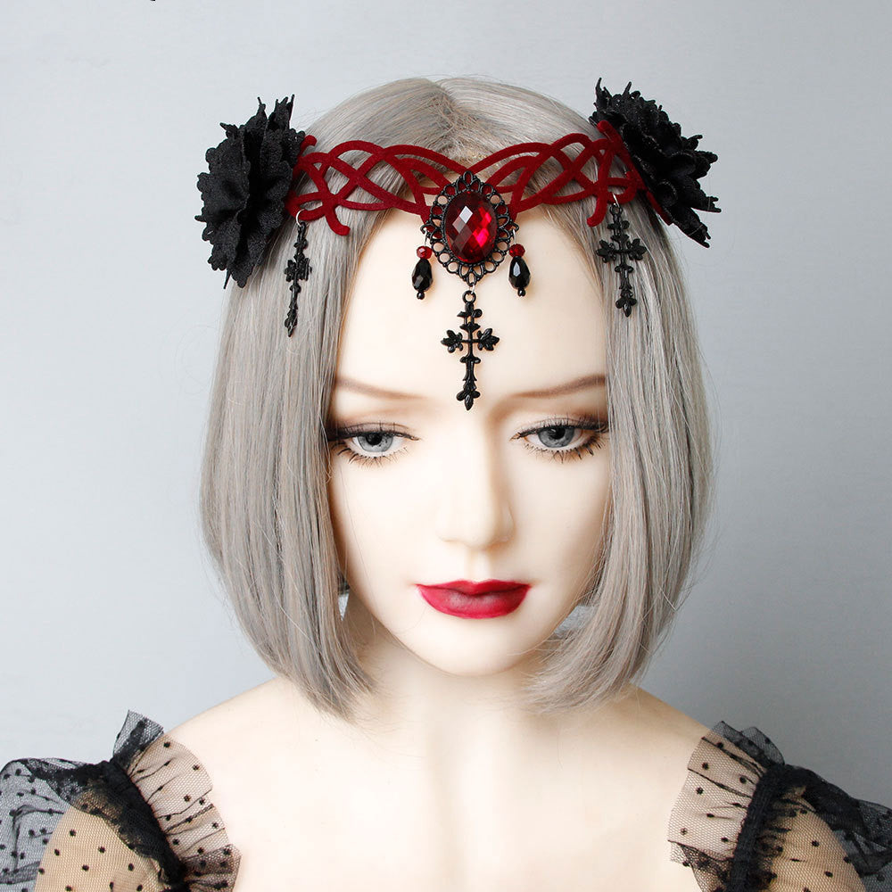 A mannequin displaying a Gothic Style Vampire Death Role Playing Cross Headdress by Maramalive™ in black attire with red jewelry.
