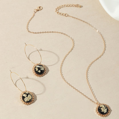 A Maramalive™ Simple All-match Jewelry Set consisting of a black and gold necklace and earrings.
