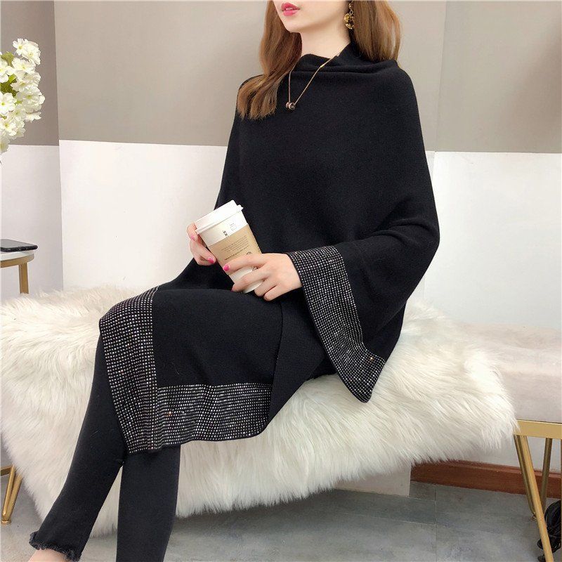 A woman in a Maramalive™ Outer Bat Sweater With Diamond Studded Black Sweater sits on a furry bench, holding a coffee cup in her simple commuting style.