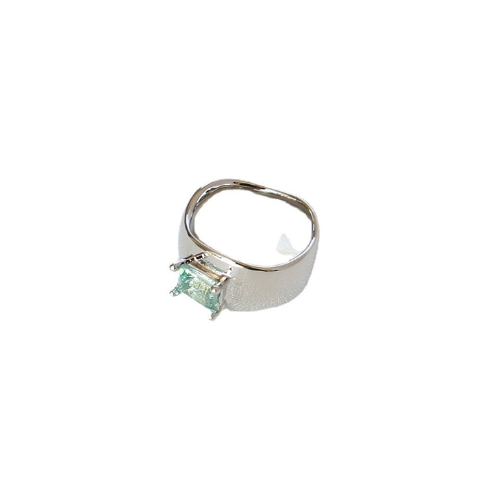 A Cold Wind Couple Ring with a green stone in the middle by Maramalive™.