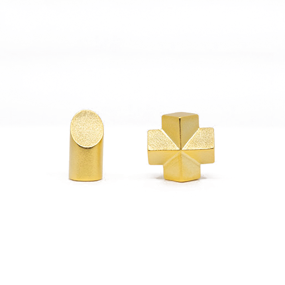 A woman's ear with a pair of Maramalive™ Geometric Earrings for Women.