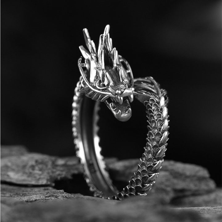 A black and white photo of a Maramalive™ silver Dragon Ring.