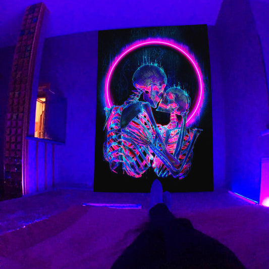 A person is comfortably resting on a Maramalive™ bed with a fluorescent tapestry UV psychedelic mushroom wall hung hippie decorative room aesthetics in a dark room.