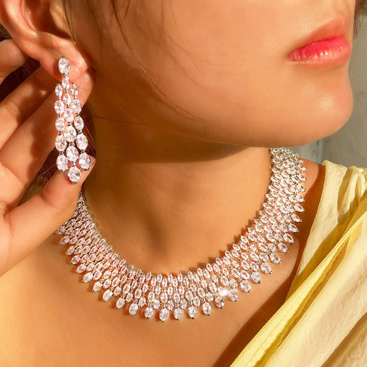 A woman wearing a Maramalive™ Shiny Cubic Zirconia Earrings and Necklace Set.