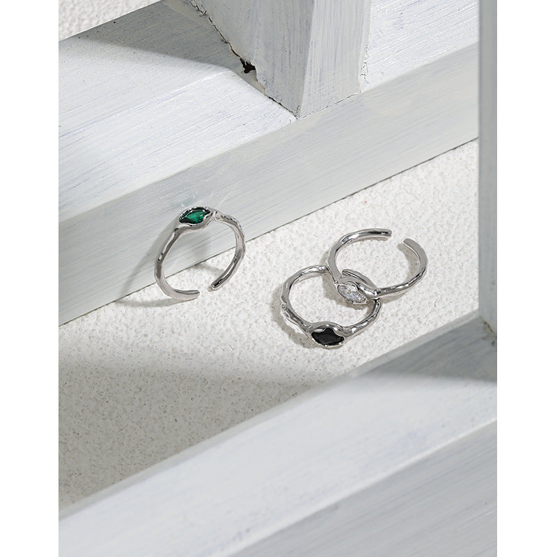 A set of three Micro-Set Zircon Sterling Silver Rings with green and emerald stones from Maramalive™.