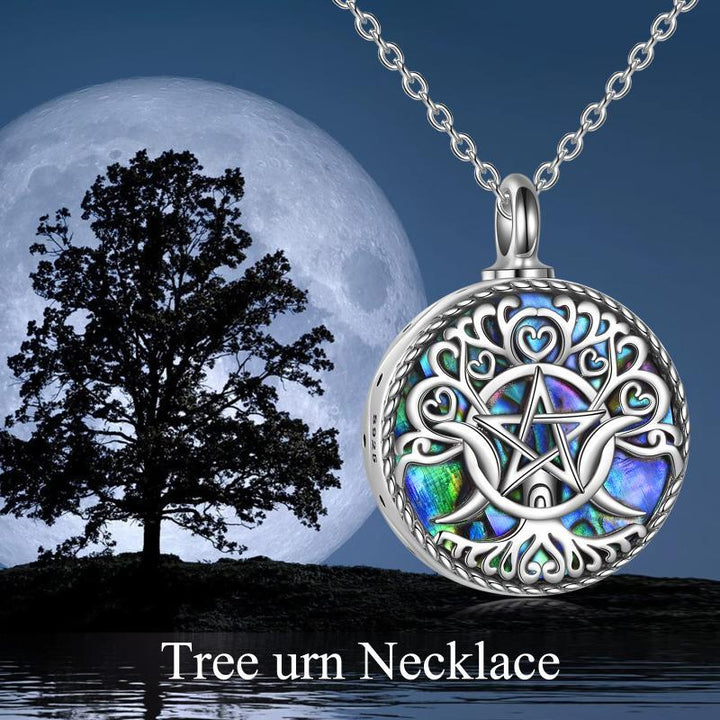 The delicate urn pendant provides a sacred vessel to hold a small portion of ashes, hair, or dried ceremonial flowers.