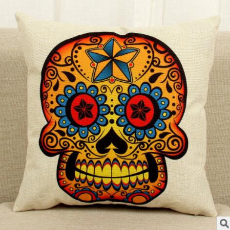 A Maramalive™ cushion with a sugar skull and roses on it.