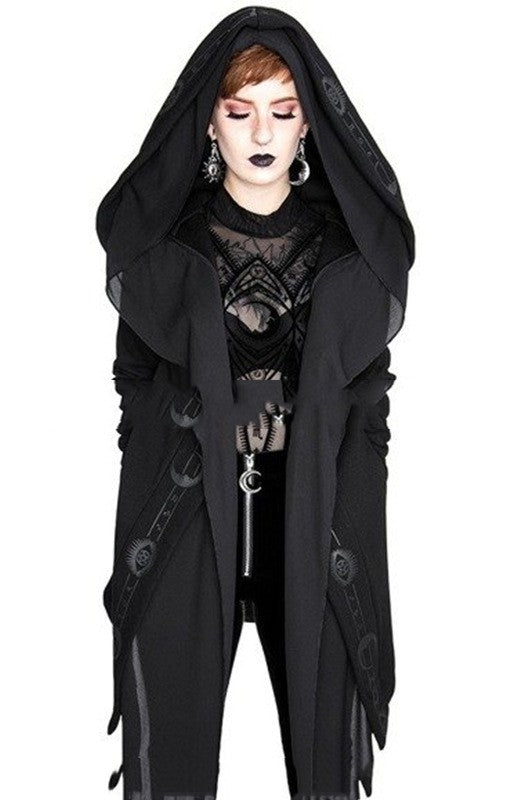 Person dressed in a Maramalive™ Irregular Black Punk Hooded Jacket Long Patchwork Printed Sweater with dark makeup and earrings, looking downwards.