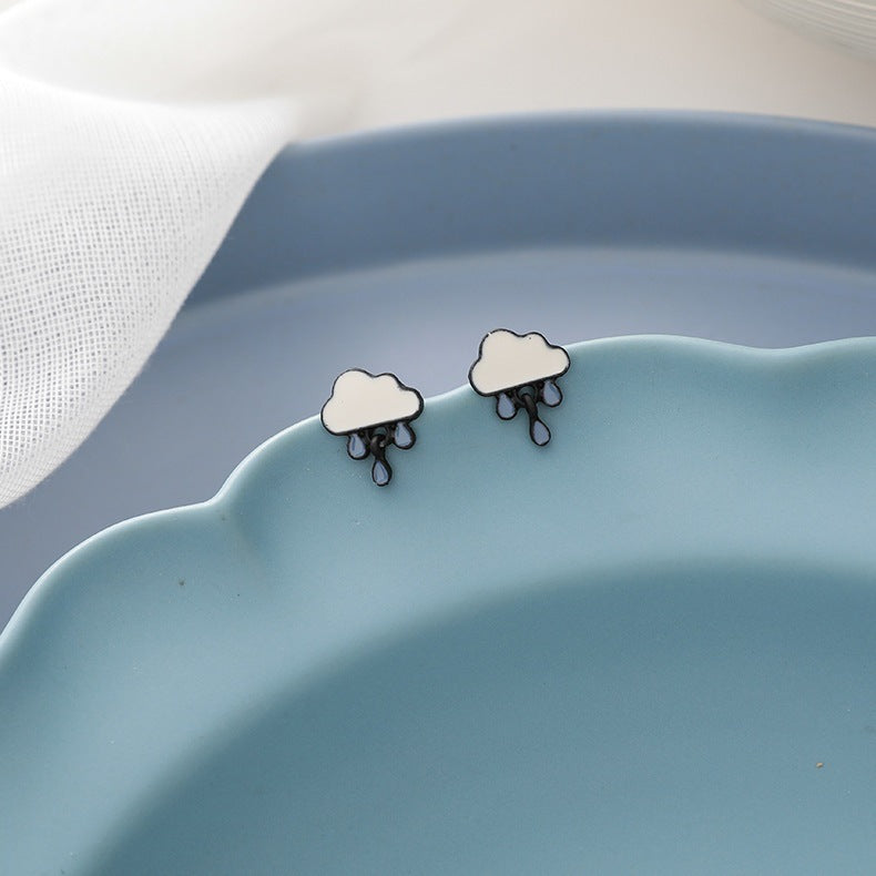 Graceful Cute Stud Earrings by Maramalive™ on a blue plate.