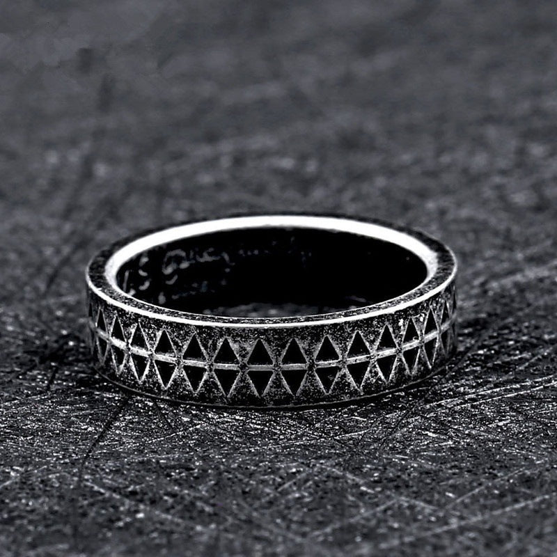 A Geometric Punk Gothic Steel Men's Ring with diamonds on it.
