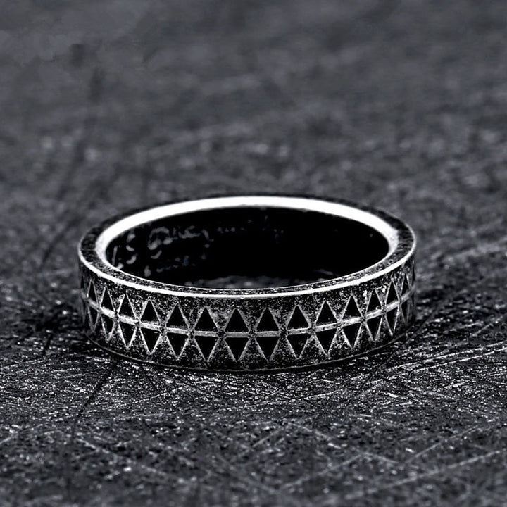 A Geometric Punk Gothic Steel Men's Ring with diamonds on it.