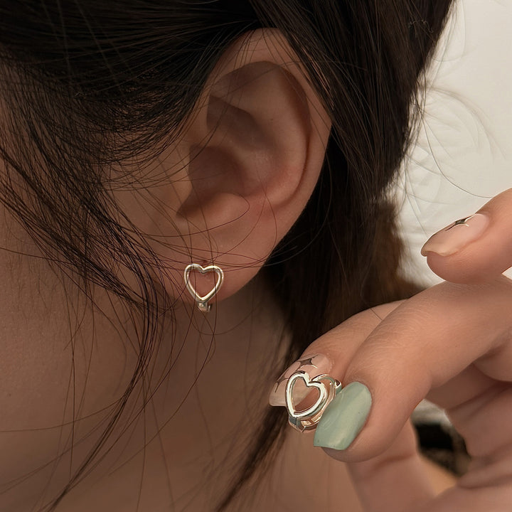 A woman's ear with a Minimalist Earrings by Maramalive™.